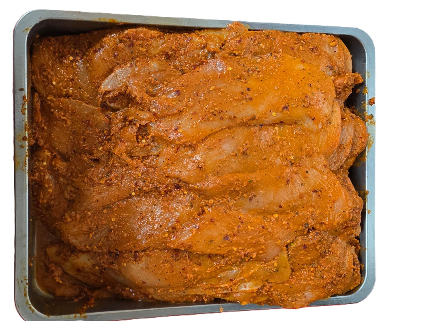 Marinated chicken at the butcher counter